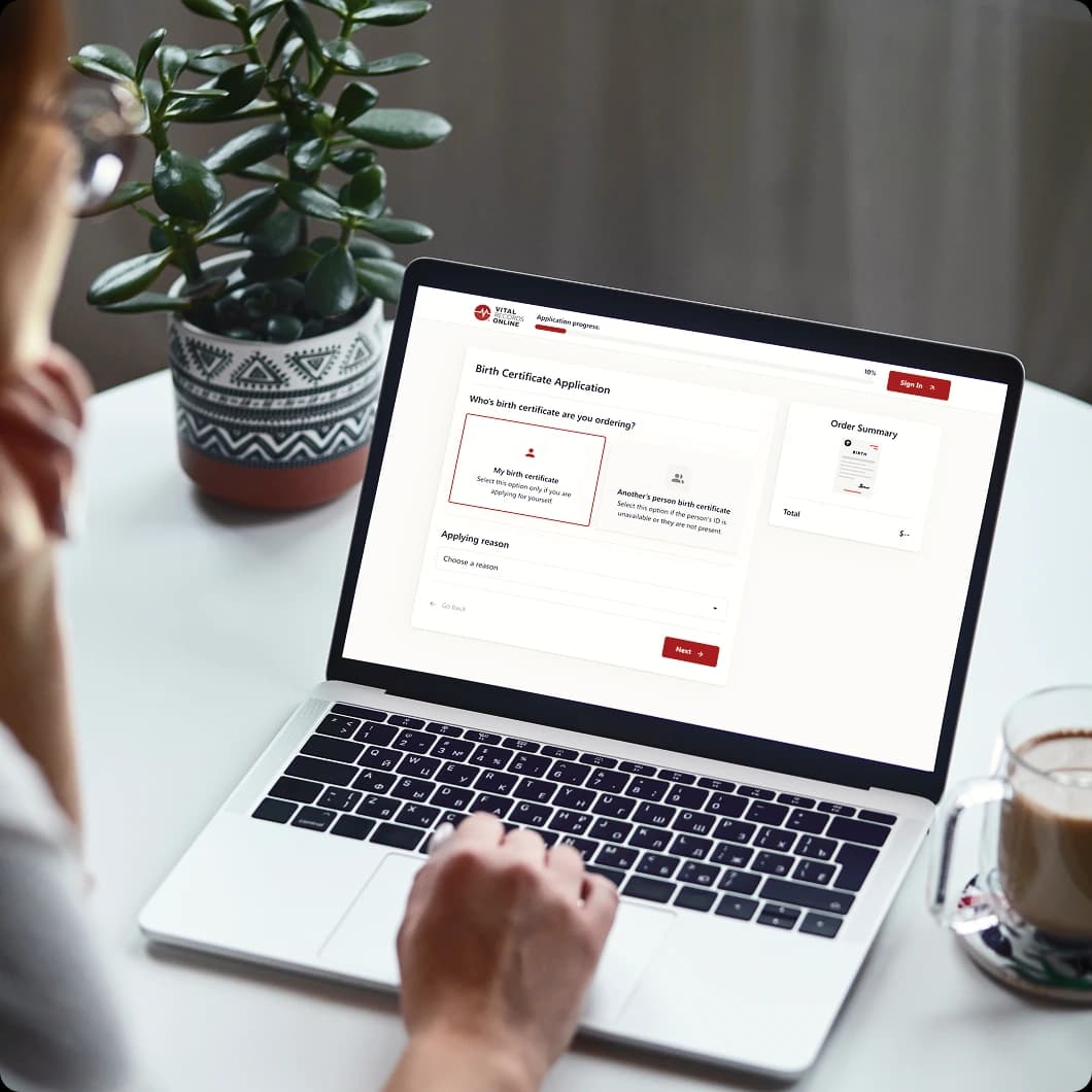 Ordering a certified birth certificate online on a laptop