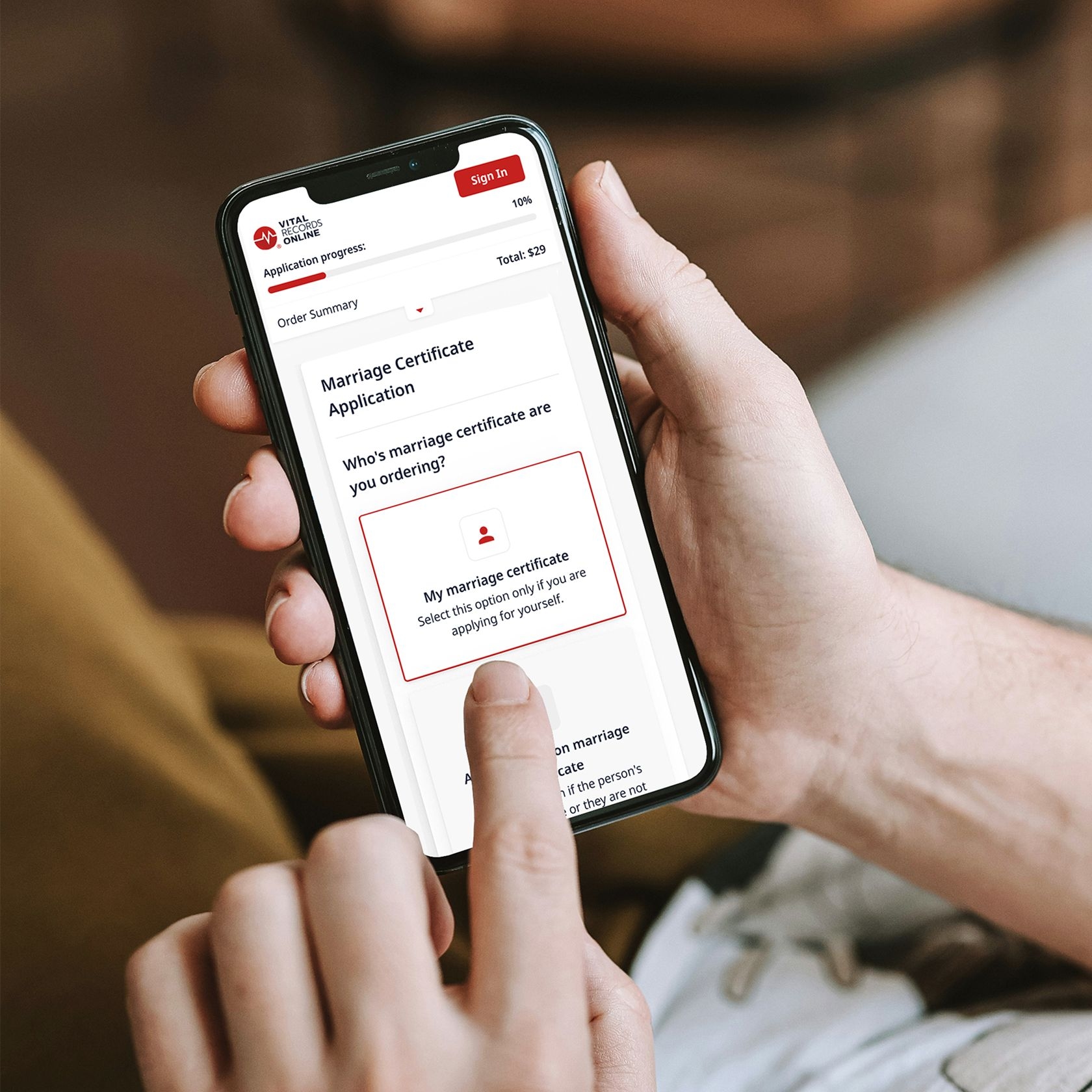 Person ordering a marriage certificate with a phone using VRO