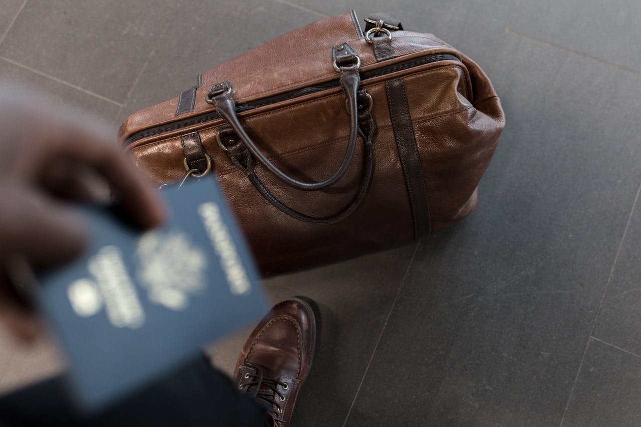 A person holding a passport after completing the steps for changing your name after marriage