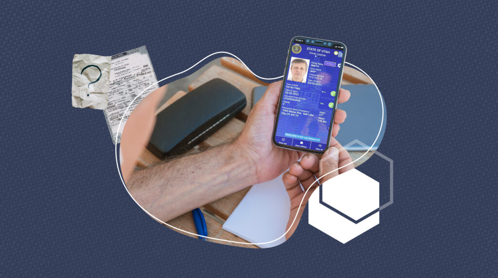 A person holding a cell phone showing the digital driver license