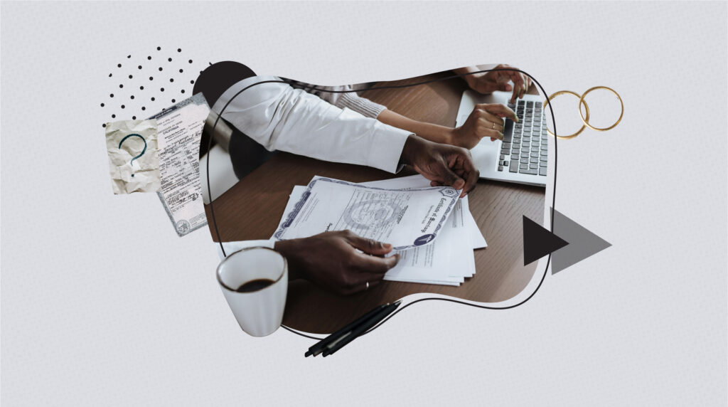 Close-up of two people at a desk, one holding a marriage certificate while the other uses a laptop and credit card. A coffee cup, pens, and paperwork are on the table. Decorative elements include wedding rings and abstract shapes, symbolizing the importance of marriage certificates for official purposes.