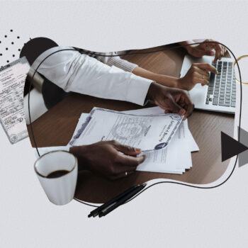 Close-up of two people at a desk, one holding a marriage certificate while the other uses a laptop and credit card. A coffee cup, pens, and paperwork are on the table. Decorative elements include wedding rings and abstract shapes, symbolizing the importance of marriage certificates for official purposes.