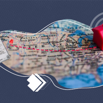 A stylized collage showing a U.S. map with a dotted red line across states, a red plastic house icon on the East Coast, and a birth certificate document on the left. The image represents moving to a new state and the need for official documents.