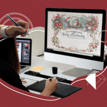 Person using a digital drawing tablet and computer displaying a decorative vintage-style “Holy Matrimony” marriage certificate design, symbolizing creative work on a certificate design project. The background is red with abstract graphic elements, including overlapping rings and geometric accents.